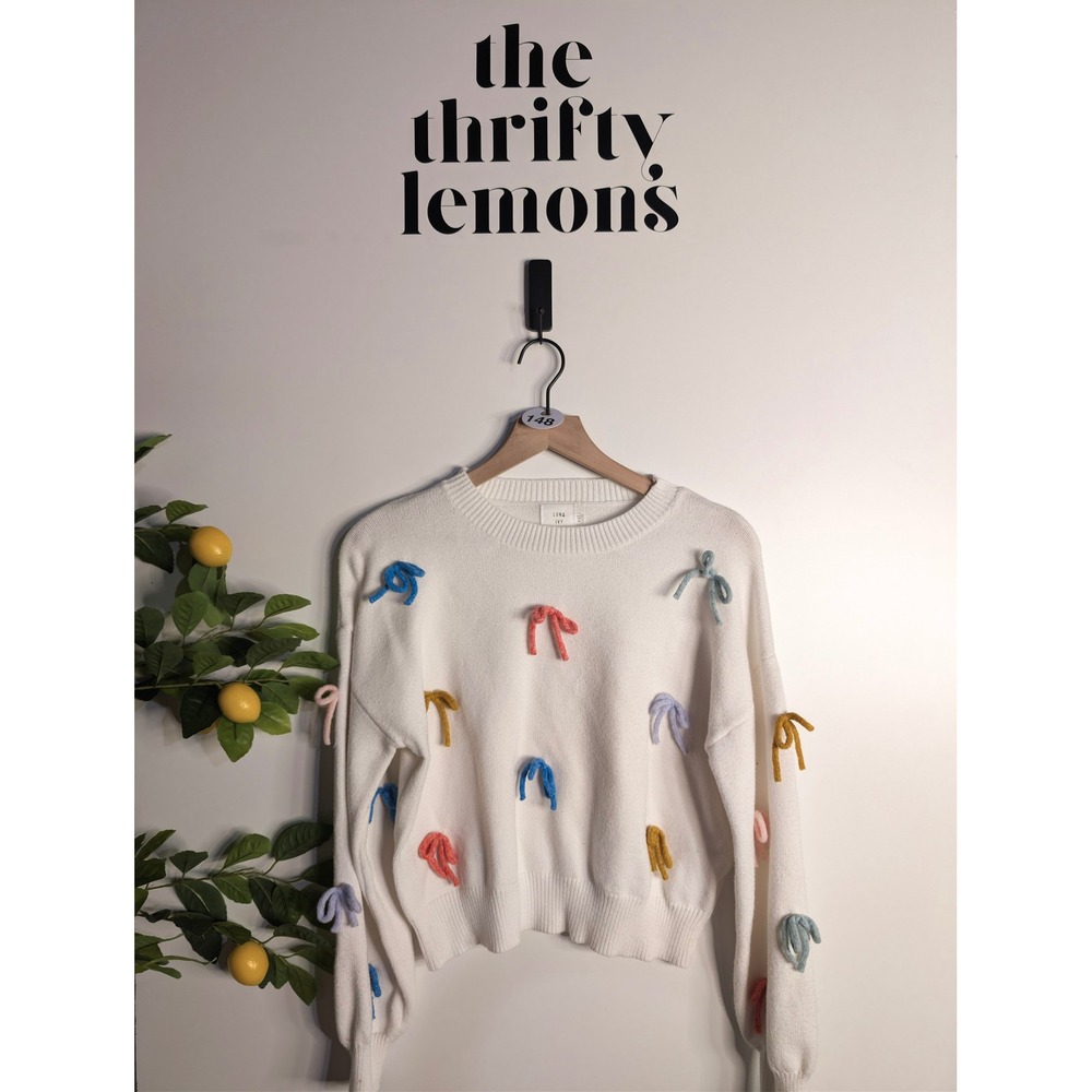 White Crewneck Sweater with Colorful Bow Accents